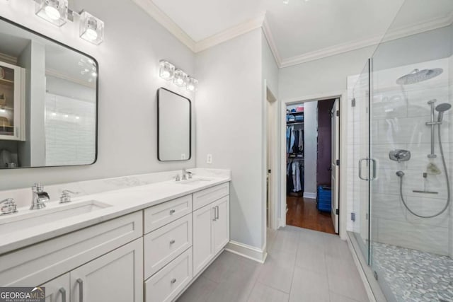 1858 Preserve Way, Atlanta, GA 30341 - bathroom with crown molding, double vanity, a shower stall, tile patterned floors, and a walk in closet