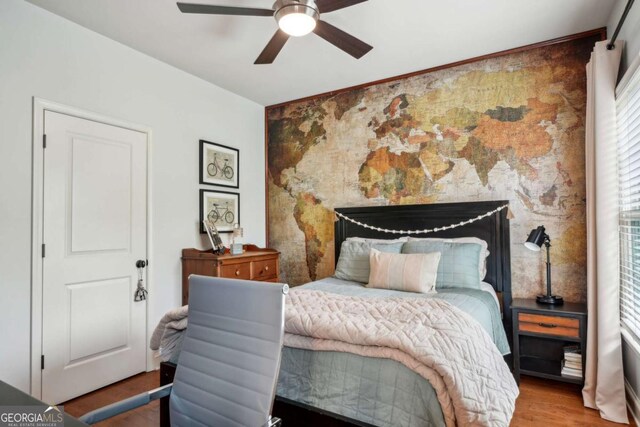 1858 Preserve Way, Atlanta, GA 30341 - bedroom with wood finished floors, an accent wall, and a ceiling fan