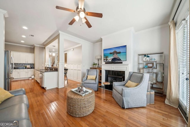 1858 Preserve Way, Atlanta, GA 30341 - living room featuring healthy amount of natural light, a tile fireplace, a ceiling fan, light wood finished floors, and recessed lighting