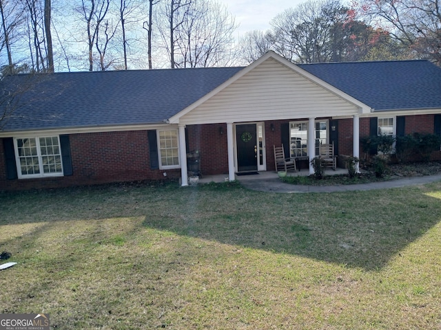 920 Courthouse Rd, Temple, GA 30179 - ranch-style home with brick siding, a front yard, and a shingled roof