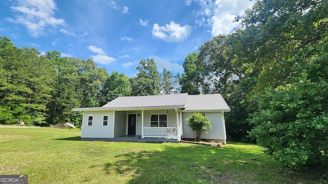 4326 Ga Highway 109, Molena, GA 30258 - view of front of house with a porch, a front lawn, and metal roof