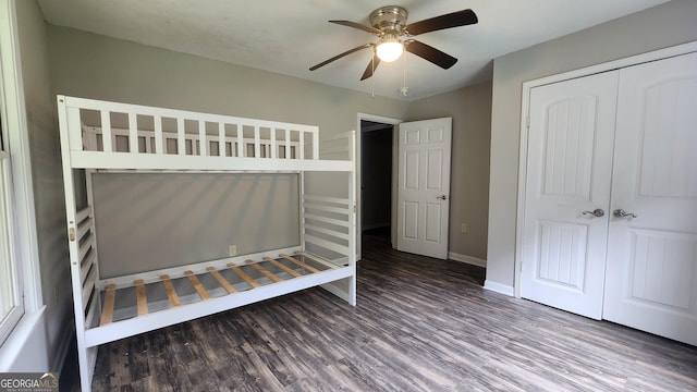 4326 Ga Highway 109, Molena, GA 30258 - unfurnished bedroom featuring wood finished floors, a closet, baseboards, and a ceiling fan