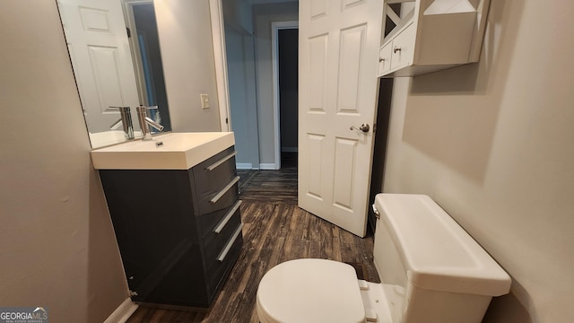 4326 Ga Highway 109, Molena, GA 30258 - bathroom with wood finished floors, vanity, toilet, and baseboards