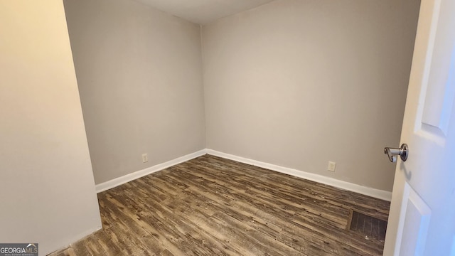 4326 Ga Highway 109, Molena, GA 30258 - spare room featuring dark wood-type flooring and baseboards