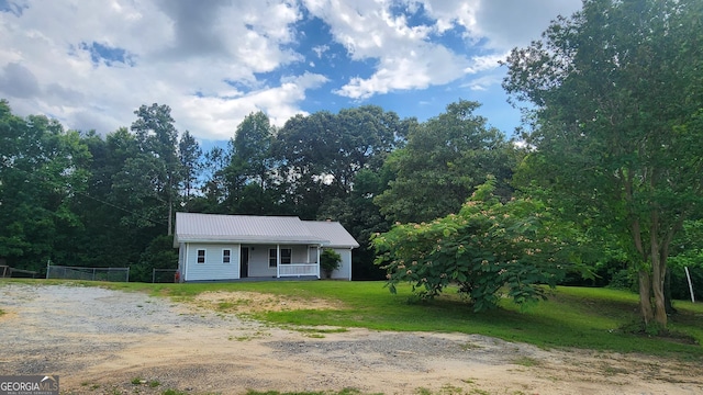 4326 Ga Highway 109, Molena, GA 30258 - view of front of home with a porch, metal roof, and driveway