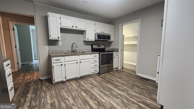 4326 Ga Highway 109, Molena, GA 30258 - kitchen featuring stainless steel appliances, a sink, light stone countertops, tasteful backsplash, and white cabinets