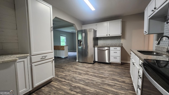 4326 Ga Highway 109, Molena, GA 30258 - kitchen featuring stainless steel appliances, a sink, backsplash, dark wood-style floors, and white cabinets