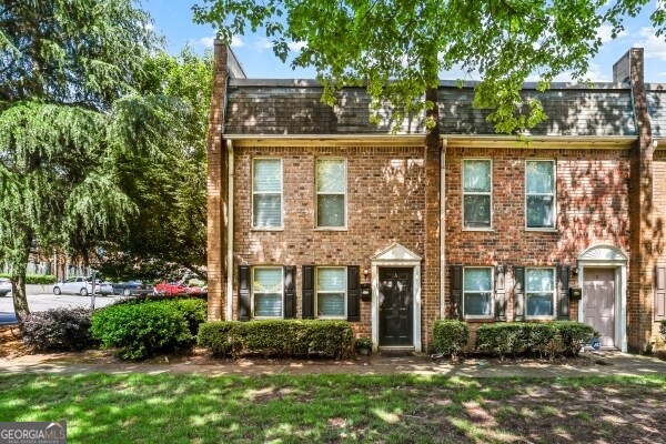 105 N River Dr Unit A, Atlanta, GA 30350 - townhome / multi-family property featuring mansard roof and brick siding