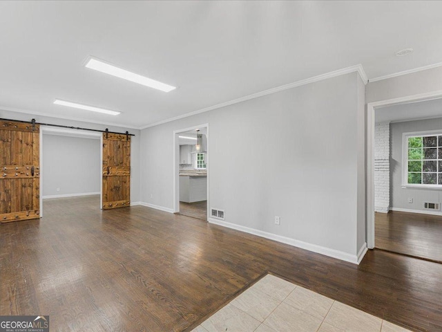 1110 Upper Hembree Rd, Roswell, GA 30076 - unfurnished living room featuring ornamental molding, wood finished floors, a barn door, and baseboards