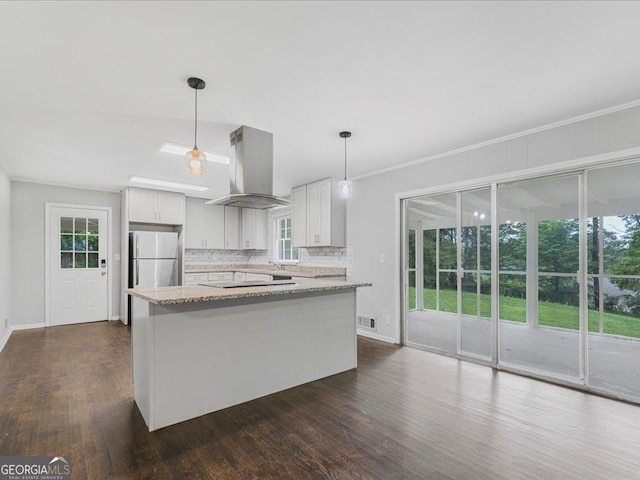 1110 Upper Hembree Rd, Roswell, GA 30076 - kitchen featuring island exhaust hood, freestanding refrigerator, dark wood-type flooring, backsplash, and crown molding