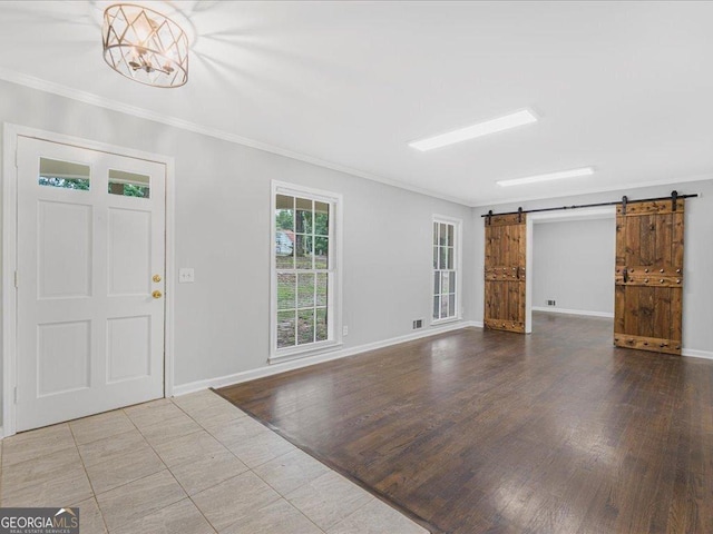 1110 Upper Hembree Rd, Roswell, GA 30076 - foyer entrance featuring crown molding, baseboards, a barn door, and wood finished floors