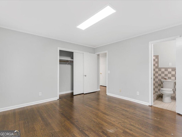 1110 Upper Hembree Rd, Roswell, GA 30076 - unfurnished bedroom featuring crown molding, wood finished floors, a closet, baseboards, and ensuite bath