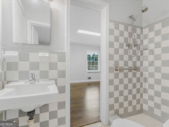 1110 Upper Hembree Rd, Roswell, GA 30076 - bathroom with a shower stall, tile walls, toilet, and a sink