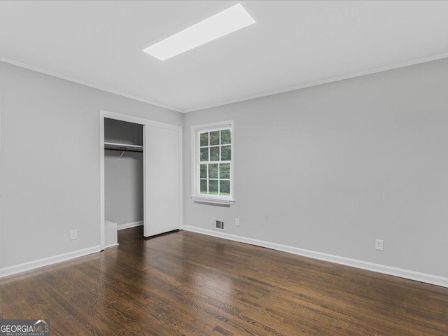 1110 Upper Hembree Rd, Roswell, GA 30076 - unfurnished bedroom featuring crown molding, wood finished floors, baseboards, and a closet