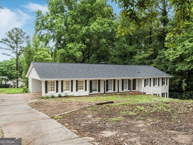 1110 Upper Hembree Rd, Roswell, GA 30076 - ranch-style house with driveway, covered porch, roof with shingles, and a carport