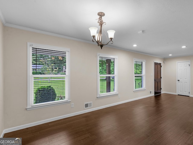 117 Thomas St, Griffin, GA 30224 - empty room with plenty of natural light, ornamental molding, baseboards, dark wood finished floors, and recessed lighting