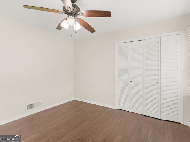 117 Thomas St, Griffin, GA 30224 - unfurnished bedroom with wood finished floors, baseboards, a closet, and ceiling fan