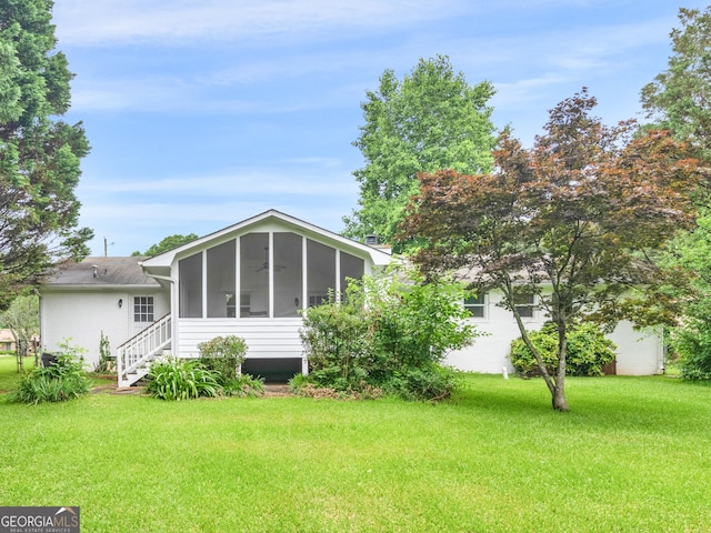 117 Thomas St, Griffin, GA 30224 - back of house with a sunroom and a lawn