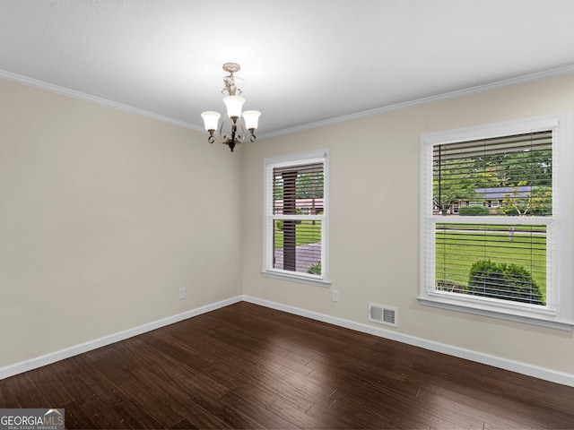 117 Thomas St, Griffin, GA 30224 - unfurnished room with a chandelier, crown molding, dark wood finished floors, and baseboards