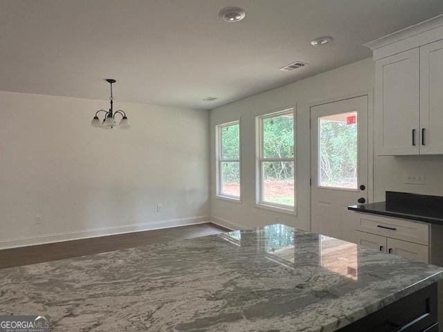 189 Warner Rd, Barnesville, GA 30204 - unfurnished dining area featuring baseboards, dark wood finished floors, a chandelier, and recessed lighting