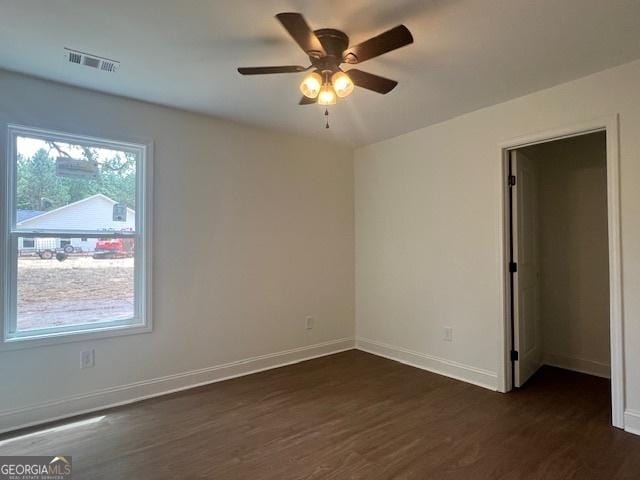 189 Warner Rd, Barnesville, GA 30204 - spare room with dark wood-type flooring, baseboards, and a ceiling fan