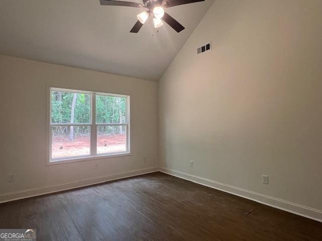 189 Warner Rd, Barnesville, GA 30204 - unfurnished room featuring dark wood-style flooring, a ceiling fan, baseboards, and high vaulted ceiling