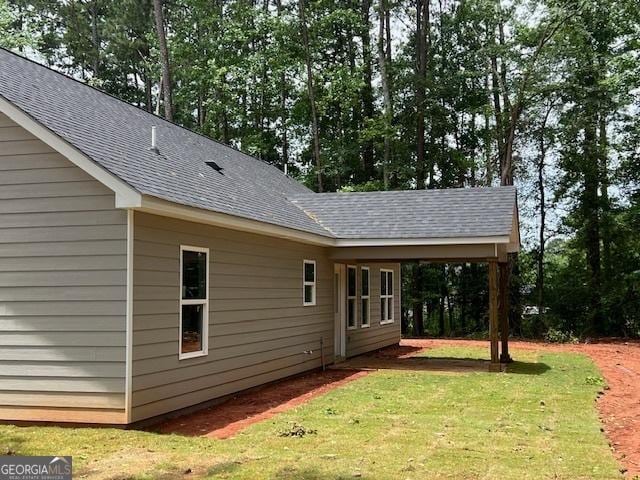 189 Warner Rd, Barnesville, GA 30204 - view of side of home with a yard and roof with shingles