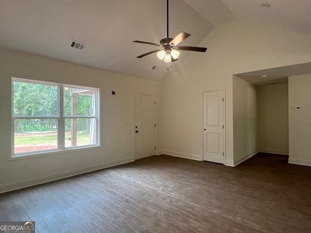 189 Warner Rd, Barnesville, GA 30204 - unfurnished living room with a ceiling fan, dark wood-style floors, baseboards, and high vaulted ceiling