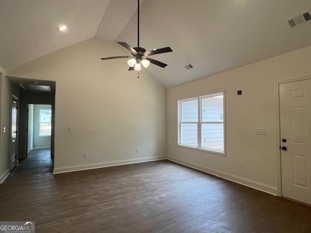 189 Warner Rd, Barnesville, GA 30204 - spare room featuring dark wood finished floors, ceiling fan, high vaulted ceiling, and baseboards