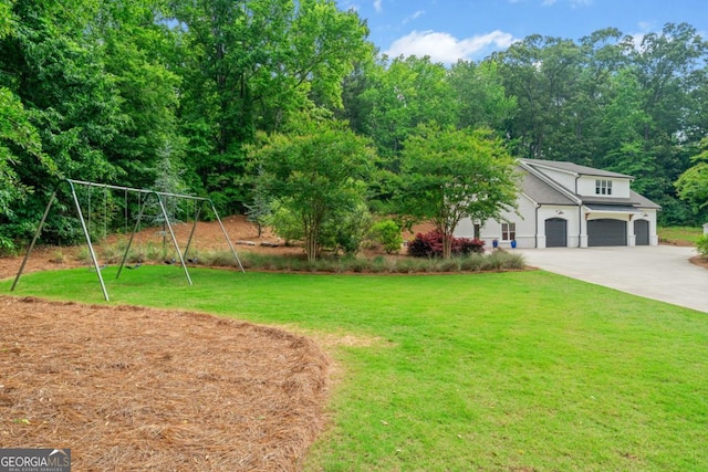 590 Arthur Rd, Canton, GA 30115 - view of grassy yard featuring concrete driveway and an attached garage