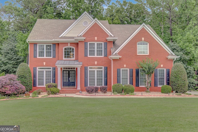 165 Hidden Lake Dr, Fayetteville, GA 30215 - view of front of home with a front yard and brick siding