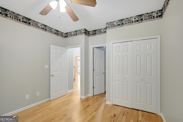 165 Hidden Lake Dr, Fayetteville, GA 30215 - unfurnished bedroom featuring light wood finished floors, baseboards, a closet, and ceiling fan