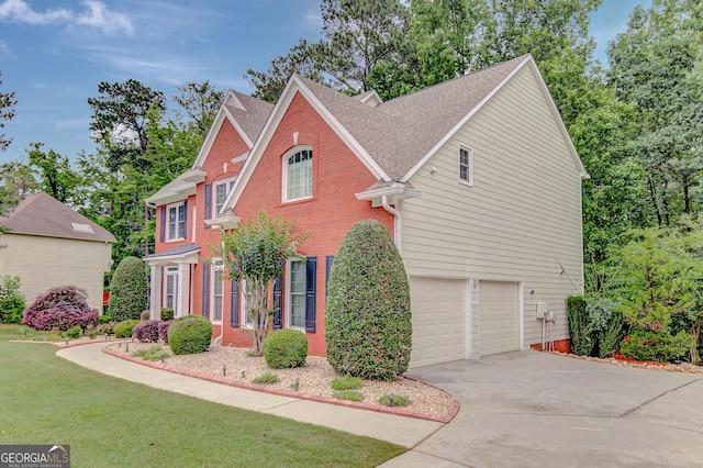 165 Hidden Lake Dr, Fayetteville, GA 30215 - view of front of house featuring a shingled roof, driveway, an attached garage, a front yard, and brick siding