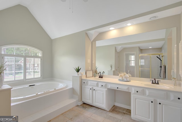 165 Hidden Lake Dr, Fayetteville, GA 30215 - bathroom featuring double vanity, vaulted ceiling, a garden tub, and a shower stall
