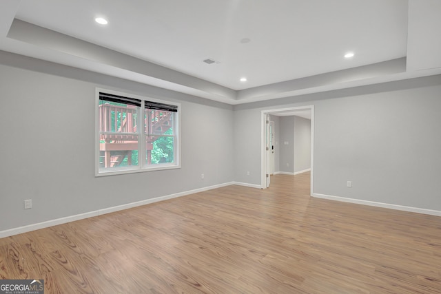 165 Hidden Lake Dr, Fayetteville, GA 30215 - spare room featuring light wood-type flooring, baseboards, recessed lighting, and a raised ceiling