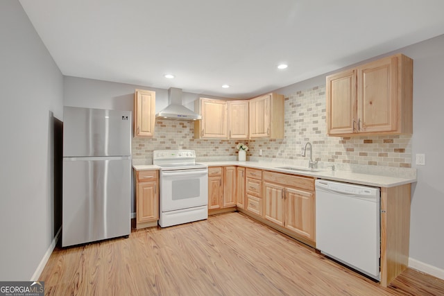 165 Hidden Lake Dr, Fayetteville, GA 30215 - kitchen featuring white appliances, wall chimney exhaust hood, light brown cabinetry, a sink, and backsplash