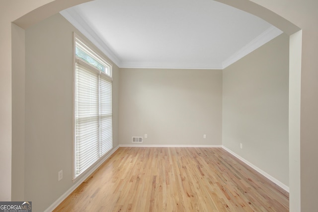 165 Hidden Lake Dr, Fayetteville, GA 30215 - unfurnished room featuring crown molding, light wood-style flooring, baseboards, and arched walkways
