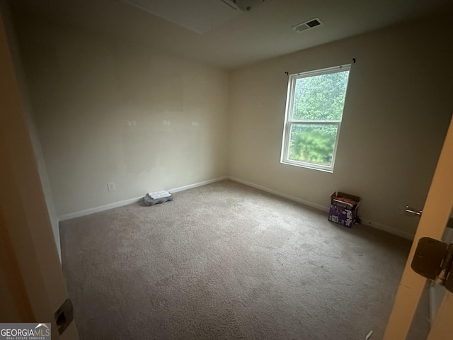 287 Ella Ct, Columbus, GA 31907 - carpeted spare room featuring attic access and baseboards