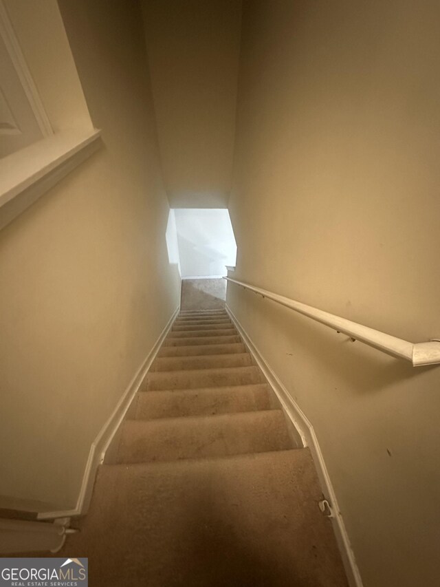287 Ella Ct, Columbus, GA 31907 - stairway with carpet floors, baseboards, and vaulted ceiling