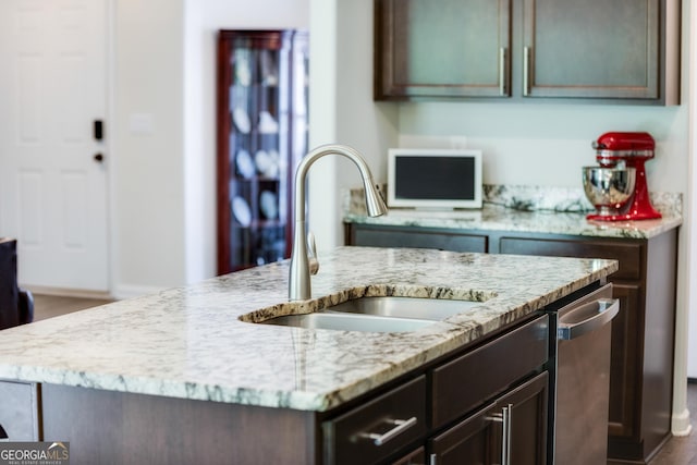 104 Johansen Way, Kingsland, GA 31548 - kitchen featuring light stone countertops, dishwasher, and dark brown cabinetry
