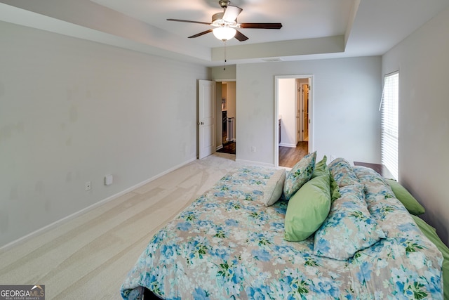 104 Johansen Way, Kingsland, GA 31548 - bedroom featuring light colored carpet, a tray ceiling, and ceiling fan