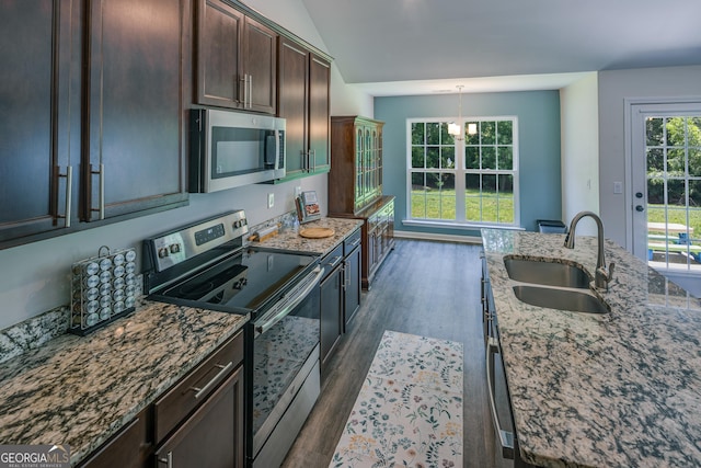 104 Johansen Way, Kingsland, GA 31548 - kitchen featuring stainless steel appliances, dark wood-type flooring, stone counters, and dark brown cabinets