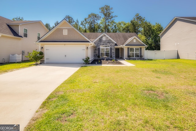 104 Johansen Way, Kingsland, GA 31548 - craftsman-style house featuring stone siding, concrete driveway, and a garage