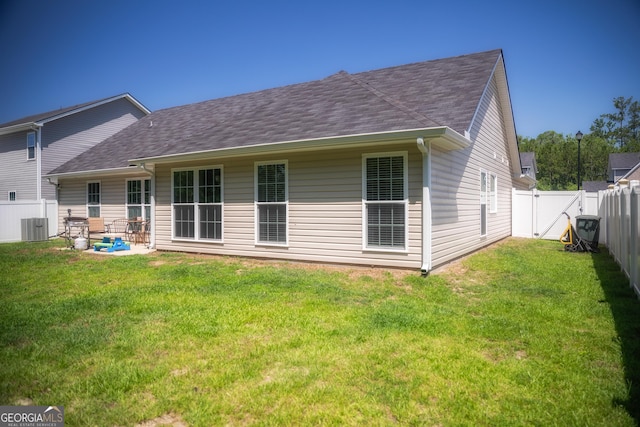 104 Johansen Way, Kingsland, GA 31548 - back of property with a fenced backyard, a gate, a shingled roof, and a patio area