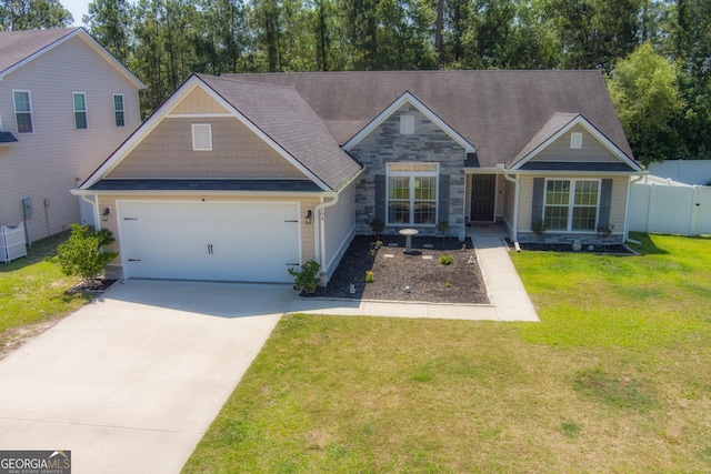 104 Johansen Way, Kingsland, GA 31548 - view of front facade featuring stone siding, a garage, and driveway