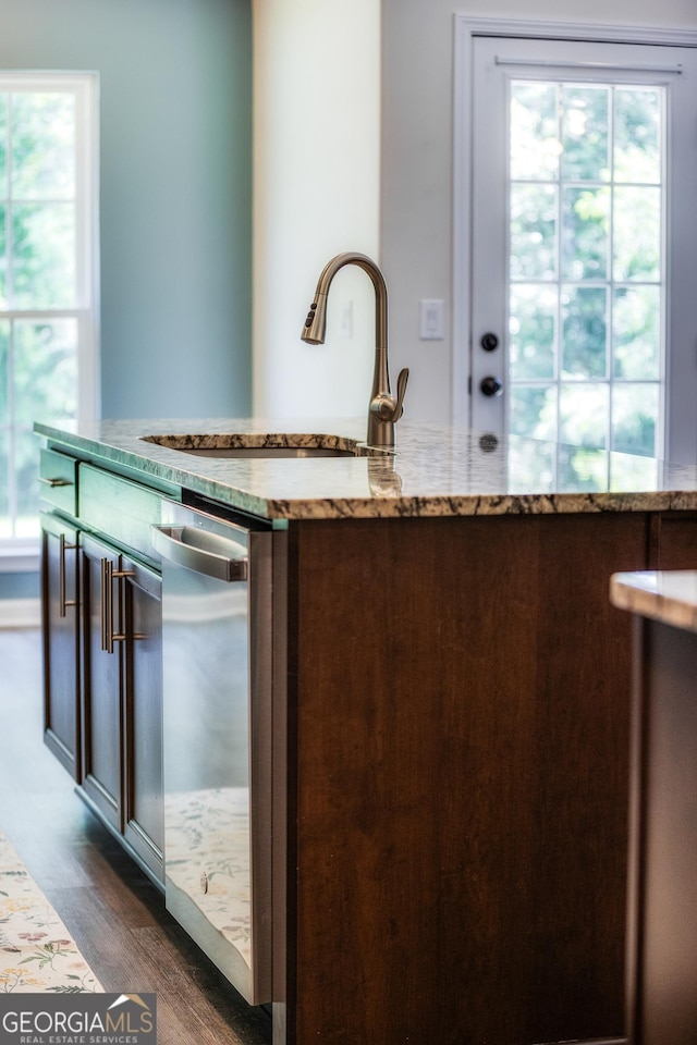 104 Johansen Way, Kingsland, GA 31548 - kitchen with stainless steel dishwasher, light stone counters, and dark wood finished floors