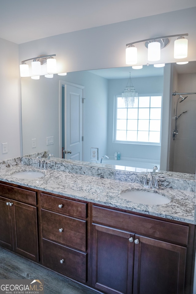 104 Johansen Way, Kingsland, GA 31548 - bathroom featuring double vanity, wood finished floors, and a shower
