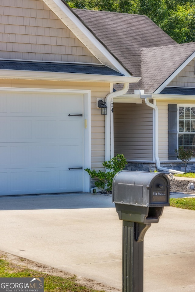 104 Johansen Way, Kingsland, GA 31548 - exterior view of gutters, concrete driveway, a downspout, and roof with shingles