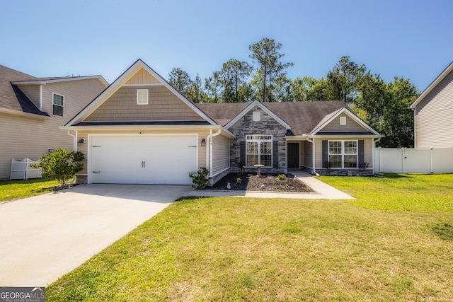 104 Johansen Way, Kingsland, GA 31548 - craftsman inspired home featuring stone siding, an attached garage, and driveway
