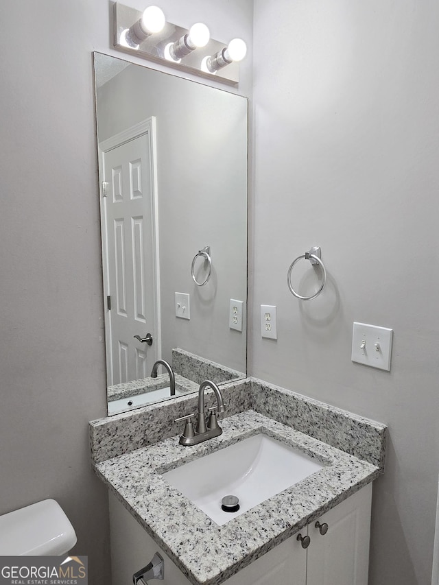 3075 Lakeside Cir, Covington, GA 30016 - half bath featuring vanity and toilet